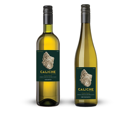 Caliche Estate-btl graphic Two bottles of Caliche Estate white wine with dark green labels featuring a striking rock graphic.