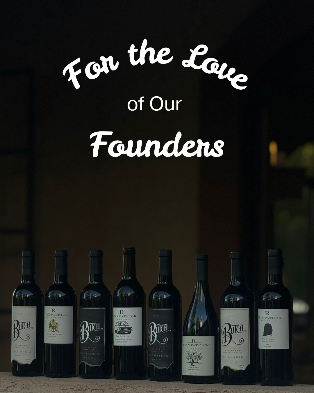 Seven bottles of wine in a row below the text For the Love of Our Founders on a dark background.
