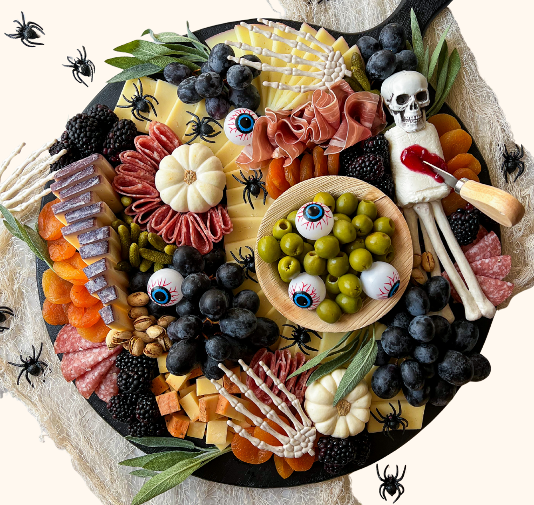 thumbnail_Halloween WORKSHOP Facebook Event Header Halloween-themed charcuterie board with spooky decorations and event workshop details on a festive background.