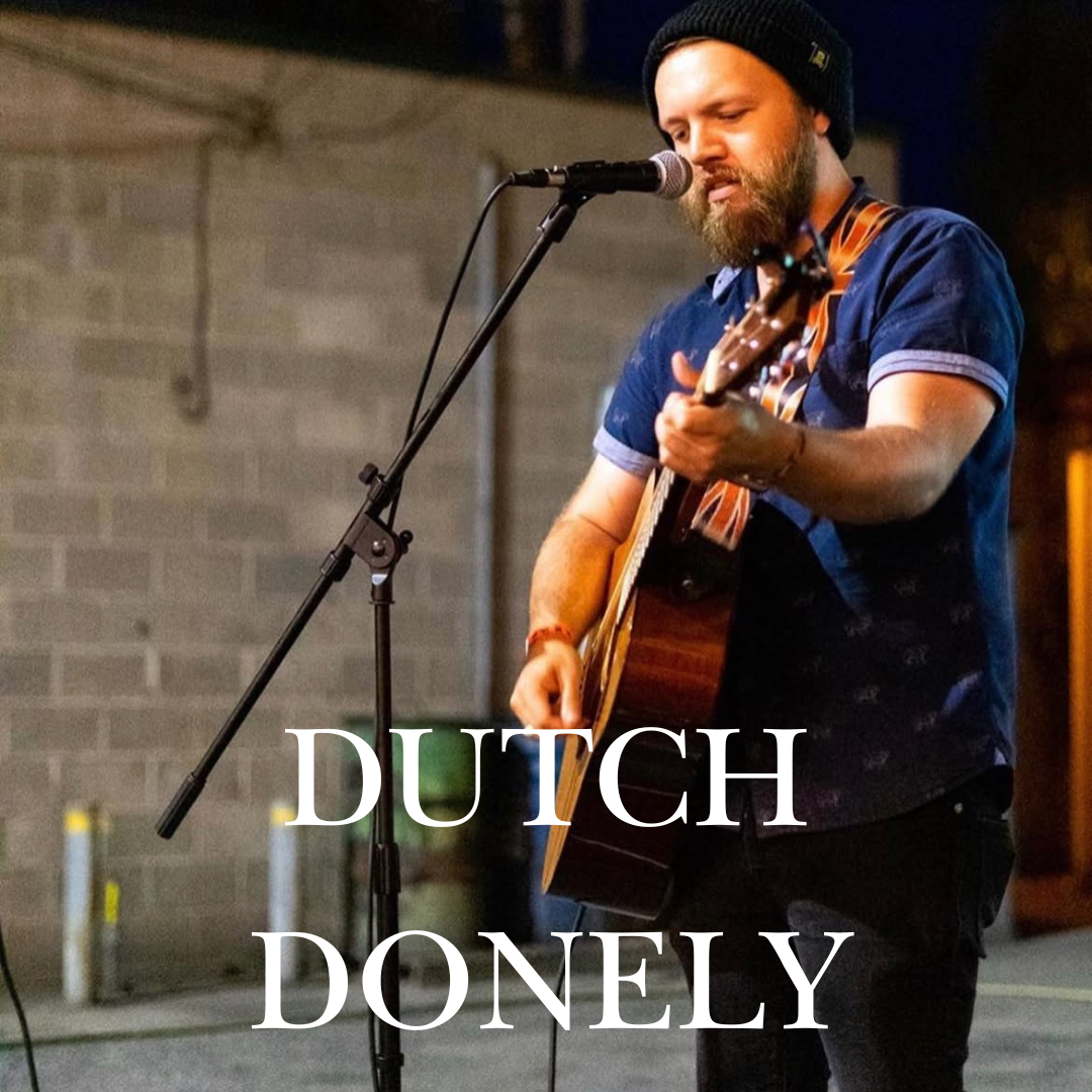Bearded man in a beanie playing guitar and singing into a microphone, text reads DUTCH DONELY.