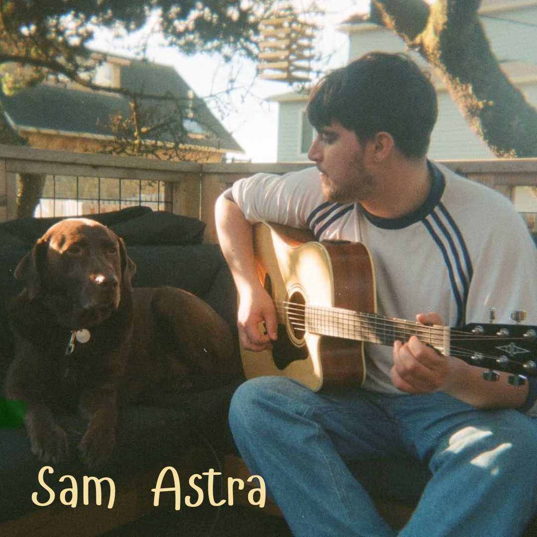 A man playing guitar next to a brown dog on a porch. Text: Sam Astra.