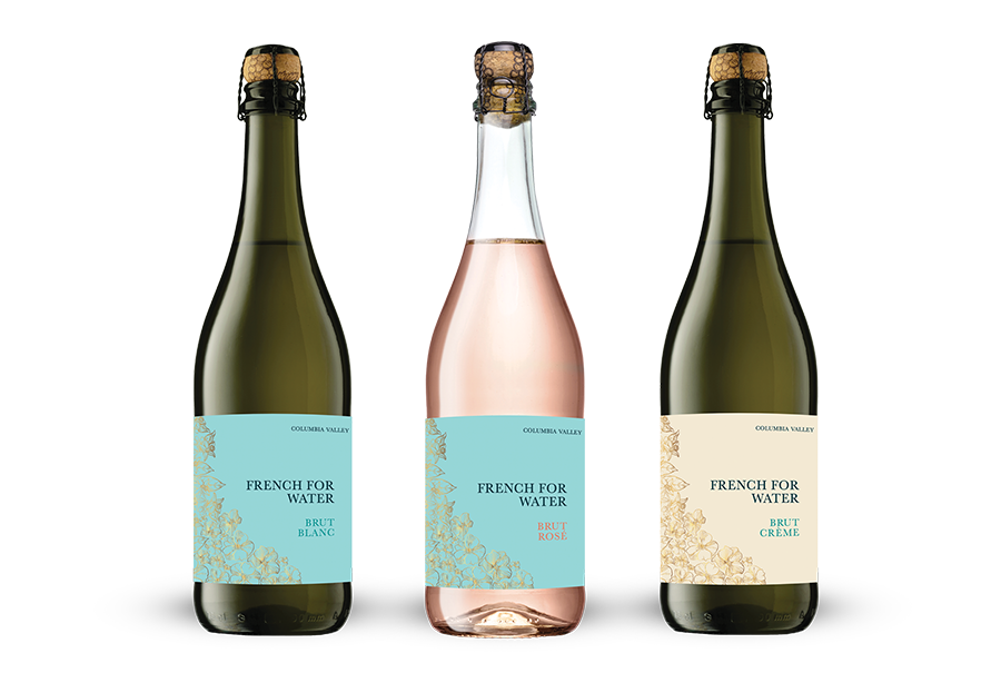 Three bottles of sparkling wine labeled French for Water against a white background.