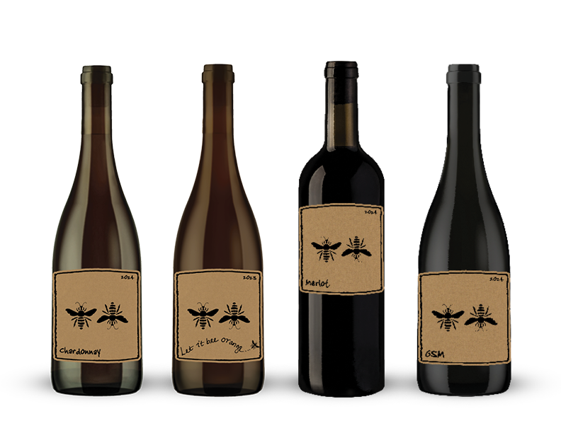 Four wine bottles with brown labels featuring hand-drawn ants; each bottle has different text.